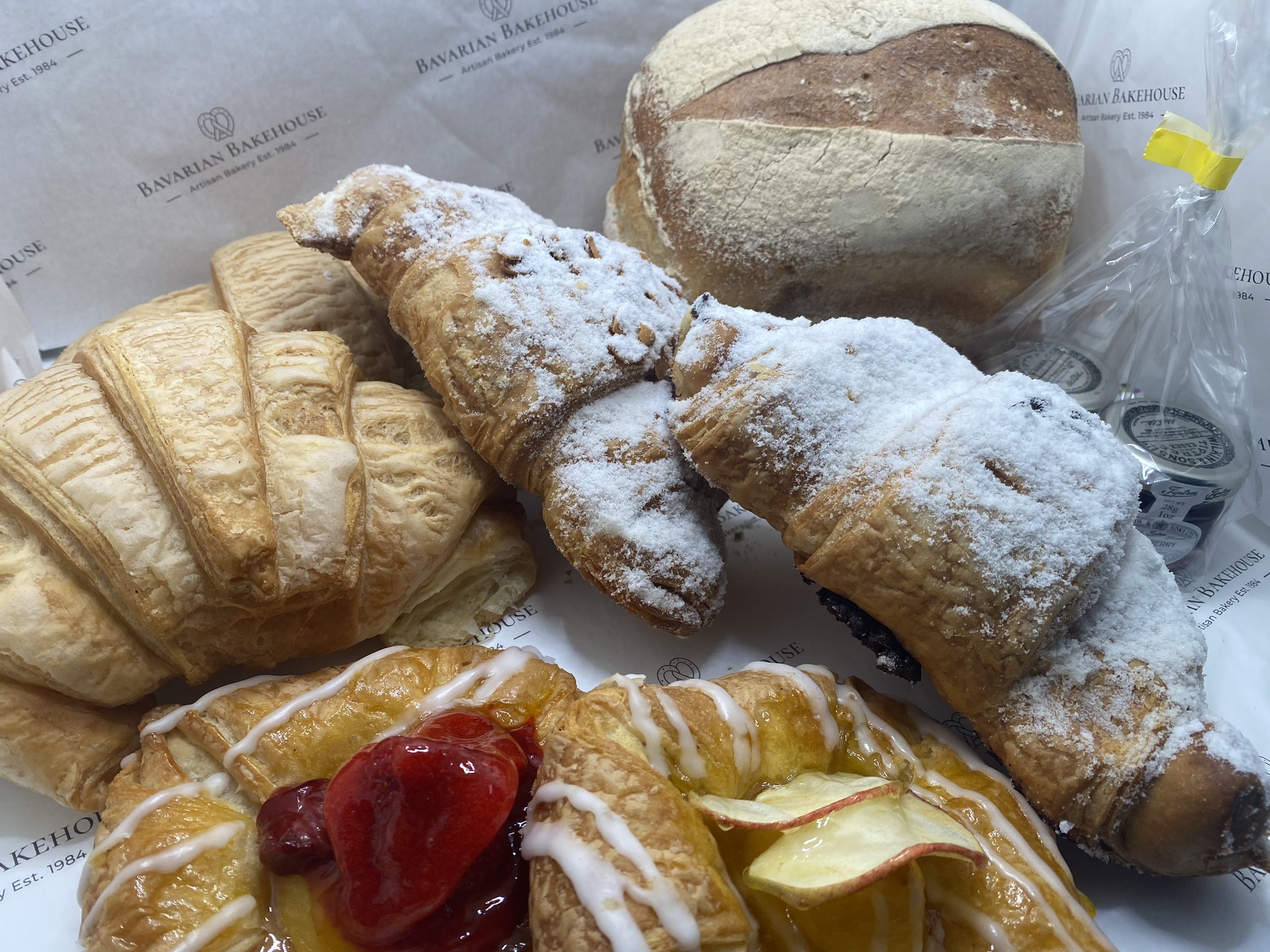 2 small loaves: one white and one wholemeal, croissant, pain choc, almond croissant, danish.