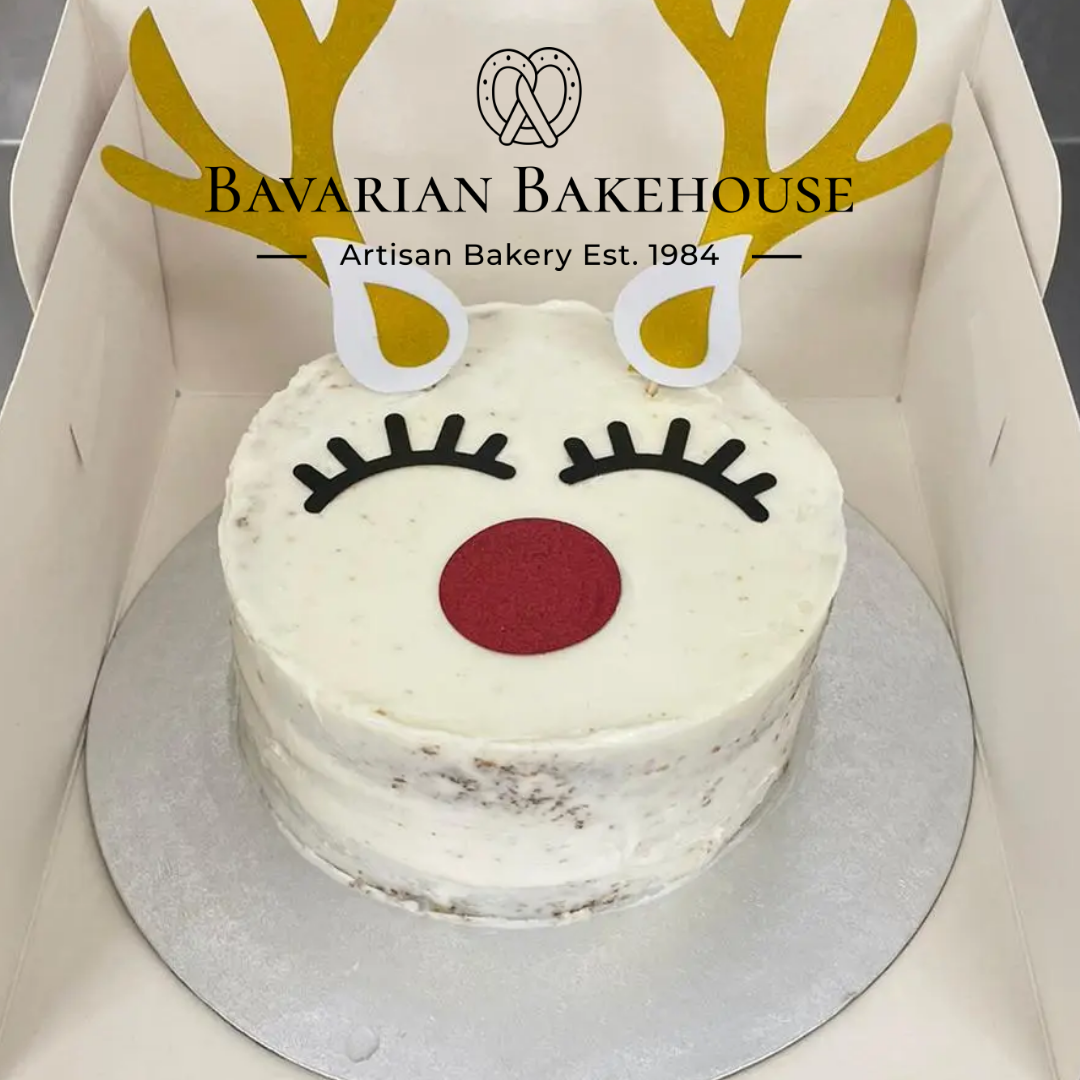 Gluten Free sponge topped with vanilla cream and a Rudolph face topper