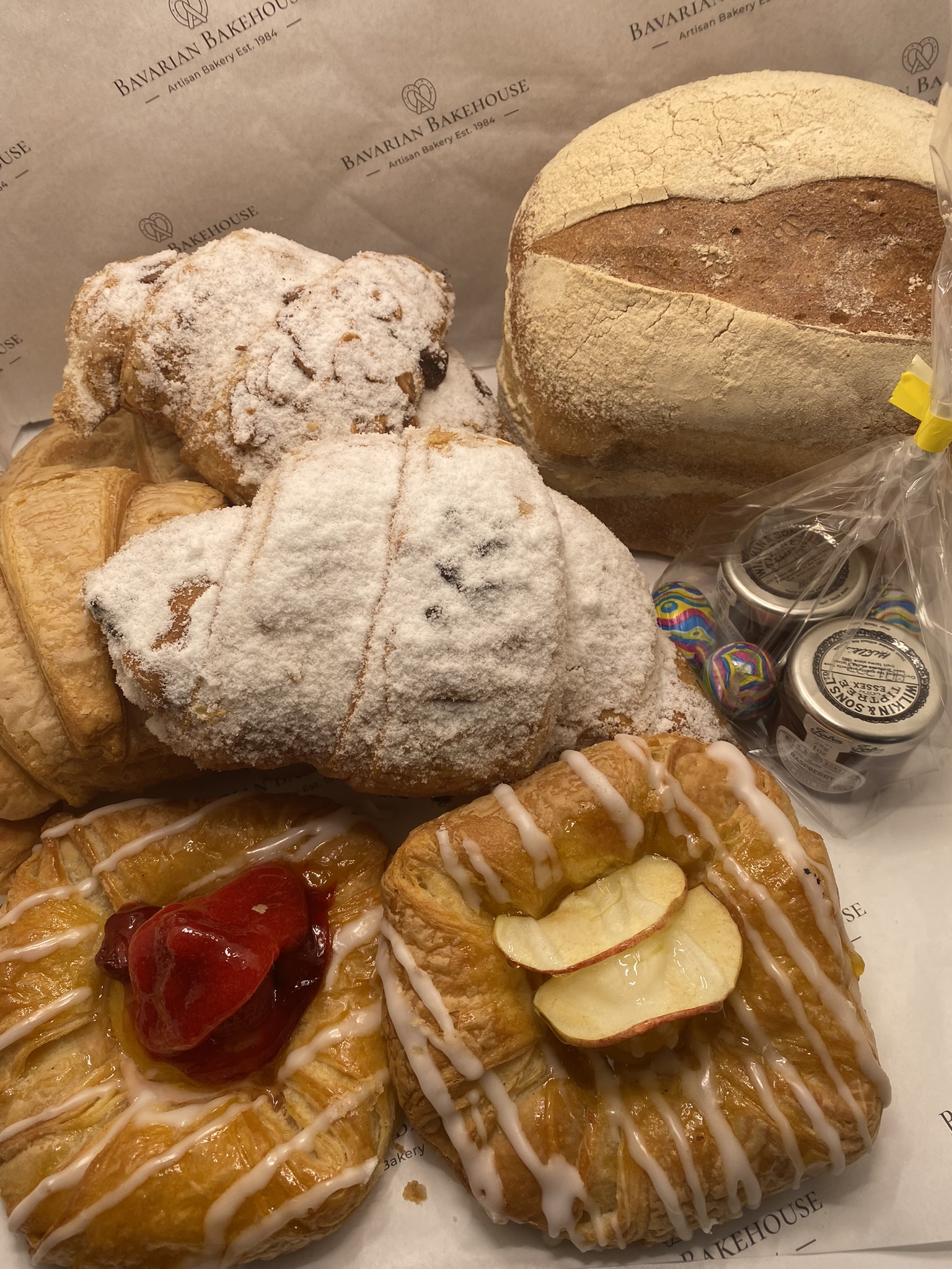 small soft white load with two mini jams two danish 2 large croissants a pain choc and an almond croissant