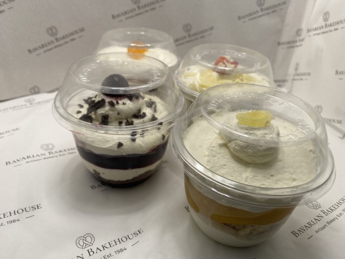 layered sponge cream and fruit filling in a POP plastic tub topped with cream and a fruit jelly or fruit. Available in black forest, lemon, strawberry or mandarin