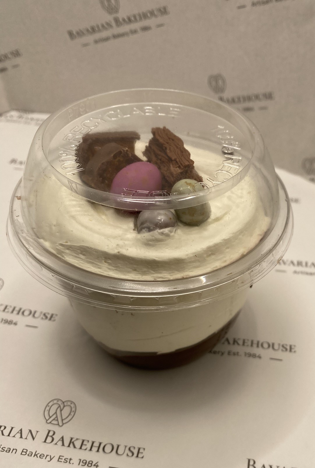layers of cream, chocolate sponge and fudge icing, topped off with mini eggs and other chocolate toppings