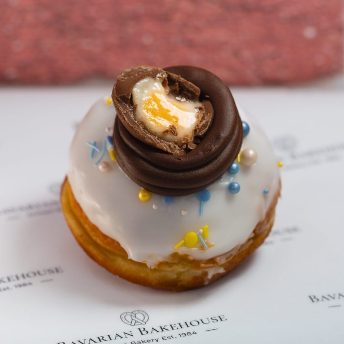 nutella cream filled doughnut, white fondant with sprinkles, a choc frosting nest and mini eggs