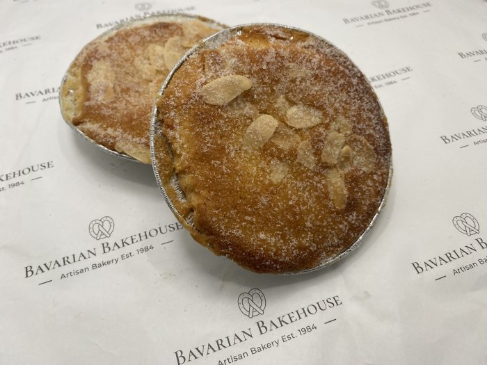 gluten free pastry case filled with fruit jam, frangipane almond filling topped with sliced almonds and sugar
