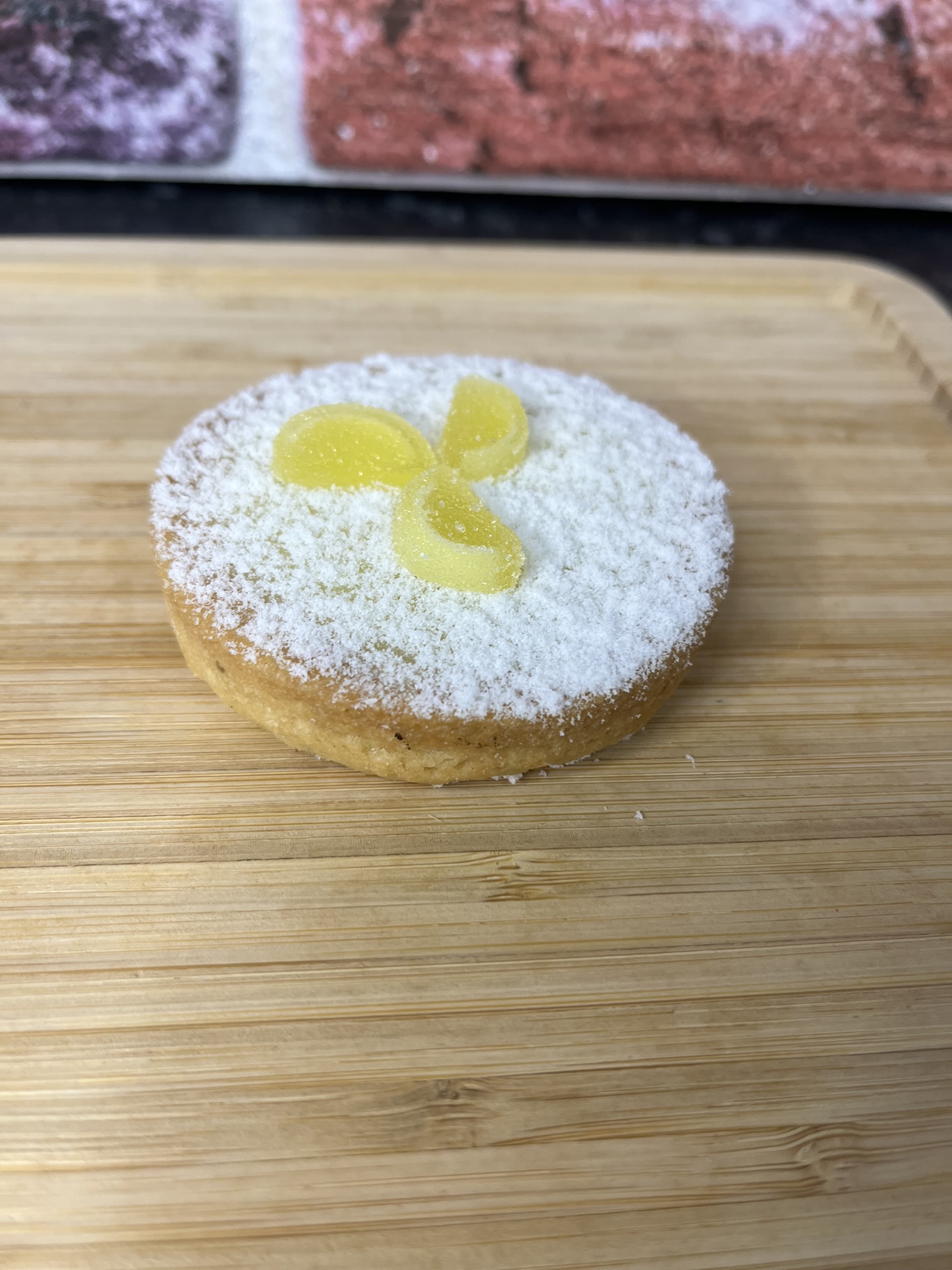 shortcrust pastry with a zingly lemon jam and sweet vanilla cream filling, topped with a jelly lemon slice