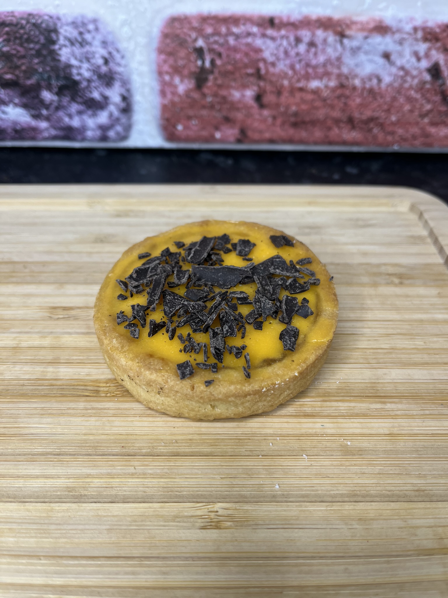 crumbly pastry base, orange cream, marmalade filling topped with dark chocolate shavings.