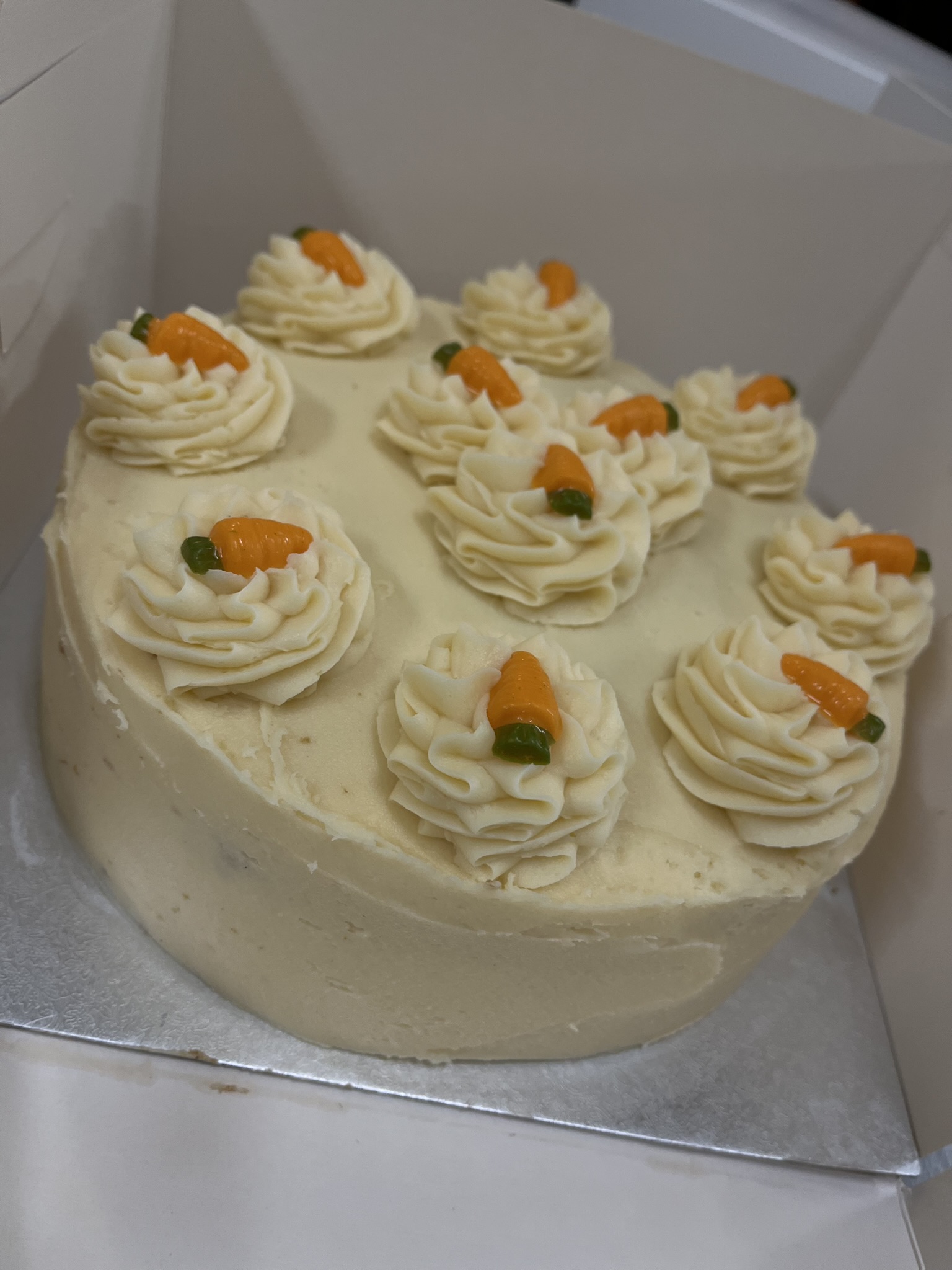 slightly spiced carrot cake sponges, fille and topped with cheese cream frosting and little white chocolate orange carrot sweets