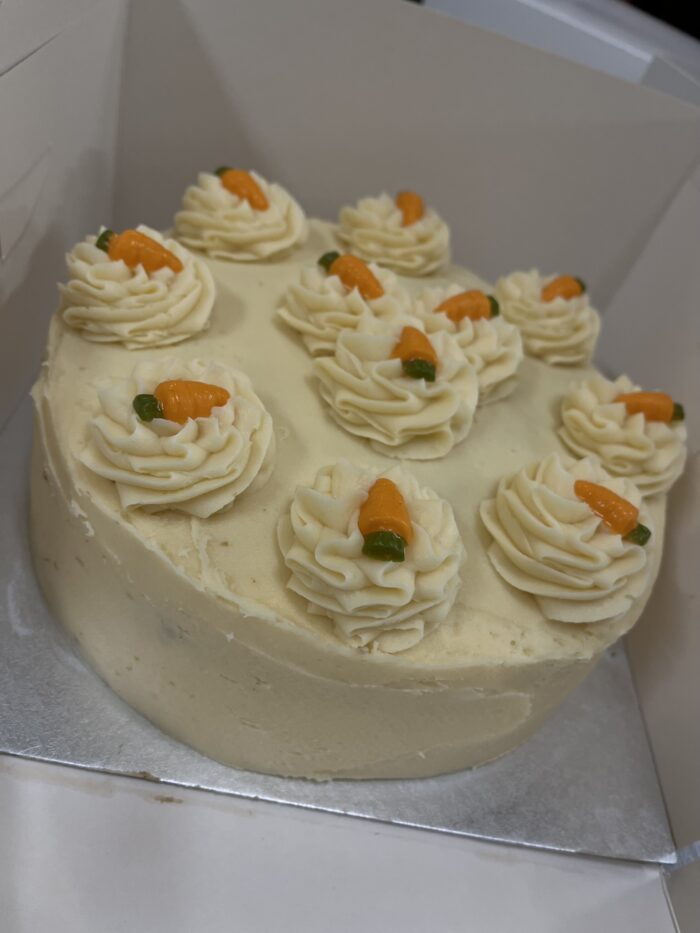 slightly spiced carrot cake sponges, fille and topped with cheese cream frosting and little white chocolate orange carrot sweets