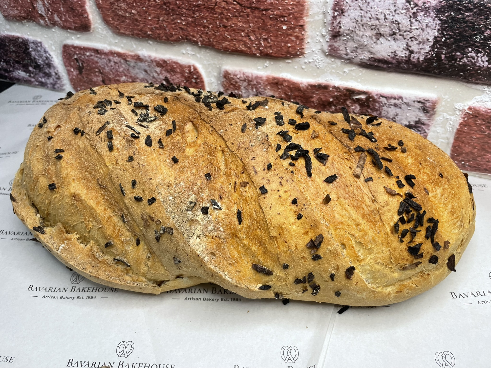 soft white italian bloomer loaf, filled and topped with kibbled onion.