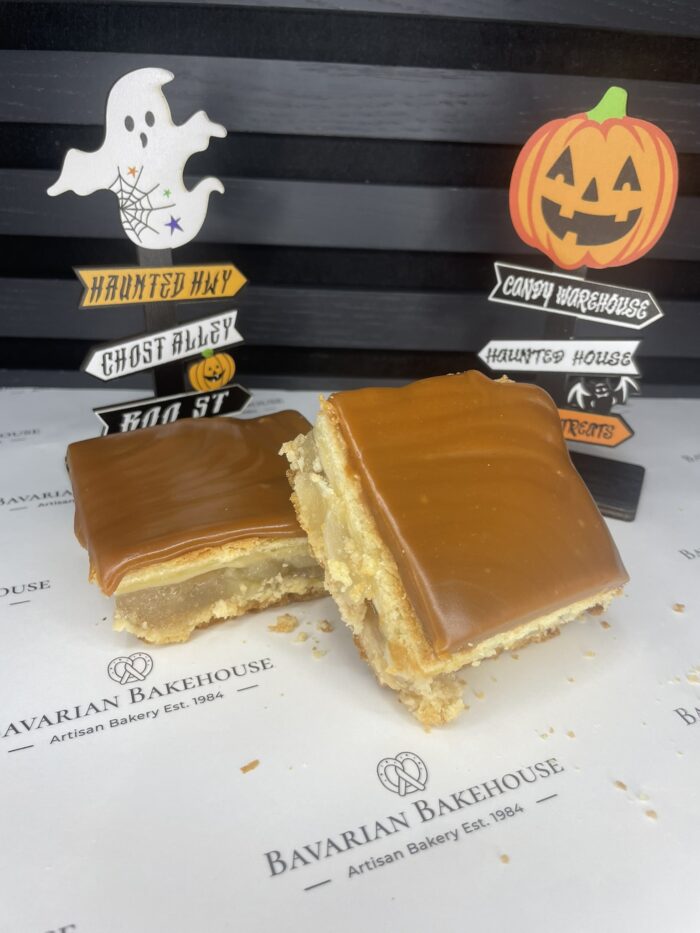 Soft crumbly layers of short paste, filled with a tangy apple pie filling and topped with a thick layer of chewy caramel